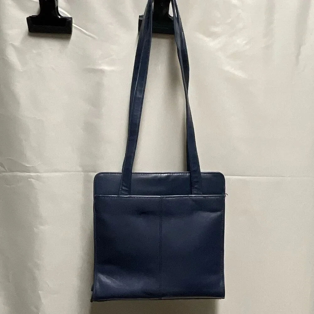 Vintage Colette blue leather shoulder bag.